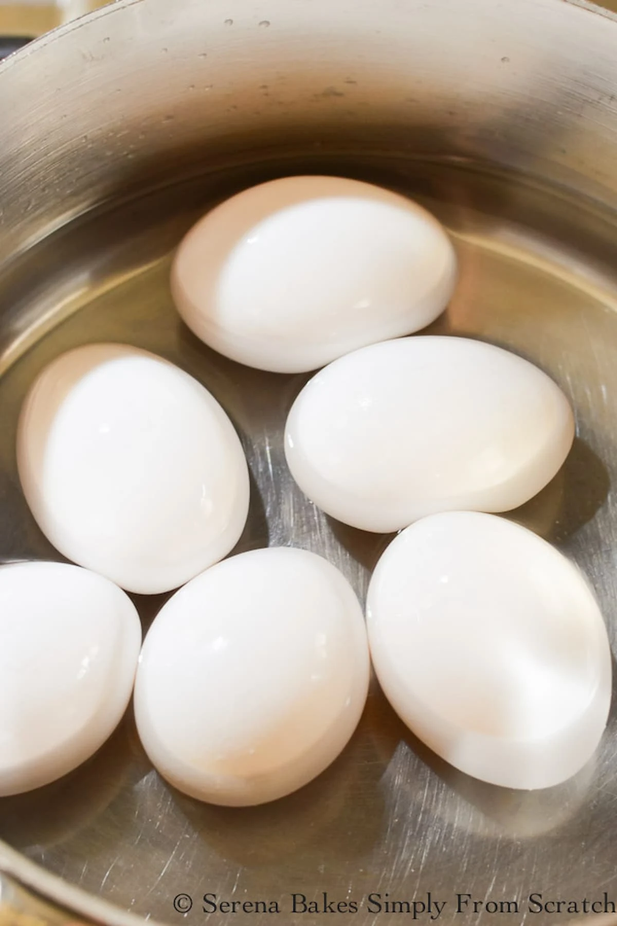 6 whole Eggs in a stainless steel pot filled half way up the eggs with water.