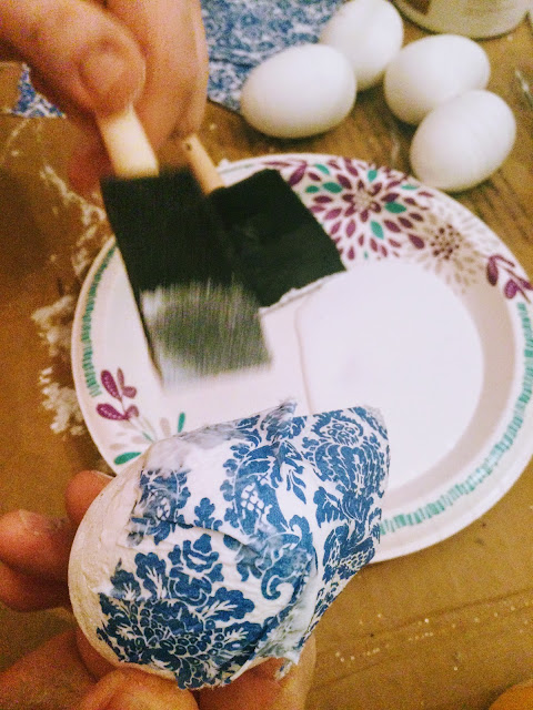 Decoupaging eggs with decorative napkins