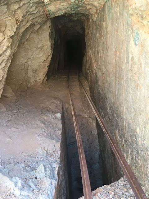 Looking inside the south adit of the Betty Lee Mine vertical shaft occupies half the tunnel floor just inside the entrance