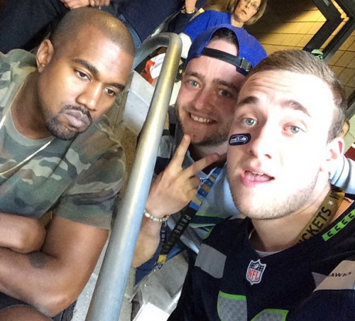 001 Pics: Kanye refuses to crack a smile while taking selfies with fans