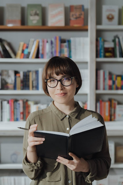 A woman planning a schedule to deal with the situations.