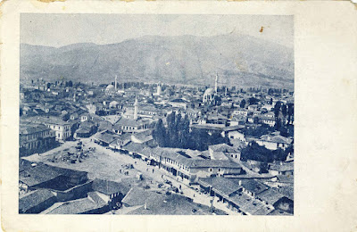 Panorama of Bitola made from the minaret of Haydar Kadi Mosque in 1915. In the foreground is “Drven Pazar” (Wood Market, later called Sheep Market ) and further is Sungur Chaush Mosque (does not exist today), Isak Mosque, Yeni Mosque and Clock Tower. The postcard was published and printed in: Printing House- Boushinov