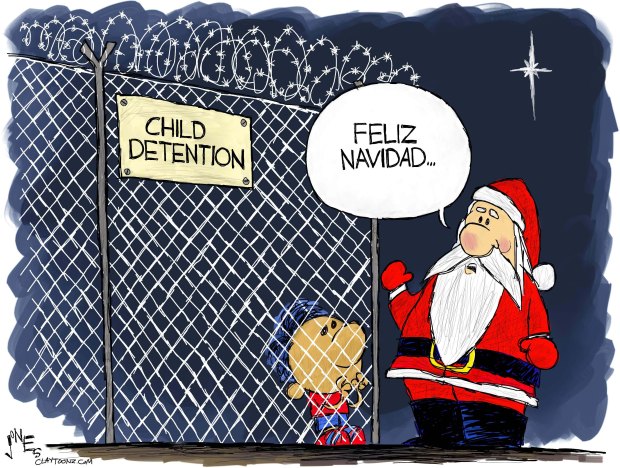 Santa Claus looking at child behind chain-link fence labeled 