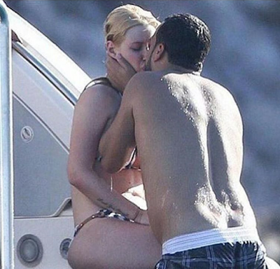 1a1a Iggy Azalea and French Montana pictured kissing on a yacht in Mexico.