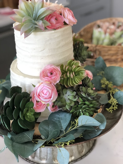 Fiesta baby shower cake with succulents and flowers