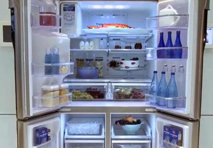 Samsung smart refrigerator T9000 with doors opened.