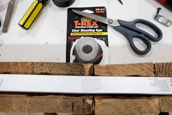 using T-Rex mounting tape to secure LED light fixture inside