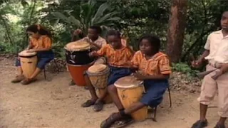 children are in Jamaica and they play bongo drums. Sesame Street Let's Make Music
