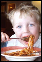 A child eating spaghetti