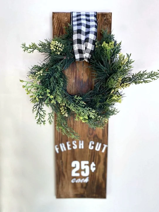 Wreath hanging on reclaimed wood with Fresh Cut stencil