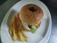 Burger bun and vegetables set by olive and toothpick for veg burger recipe