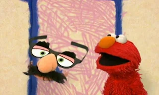Elmo has guests. The door opens and Groucho Marx glasses enter. Elmo's World Eyes Interview
