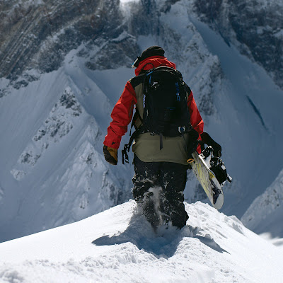 Man on a slope wearing 2014 Dakine ABS Signal 25L