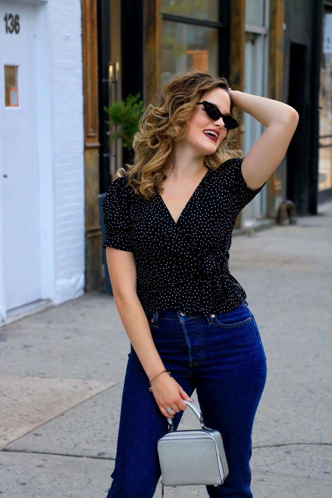 Nyc fashion blogger Kathleen Harper's fall outfit inspiration with jeans and a wrap top.