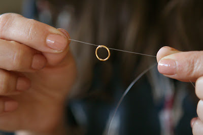 threading the jump ring onto the necklace wire