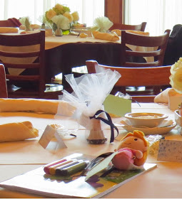 Showers of Happiness http://dragonflyandlilypads@blogspot.com Shower favors, wine corks, coloring books, dolls, table setting