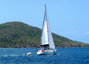 Dave and Heather aboard s/v Wild Hair as she sails the Caribbean Sea