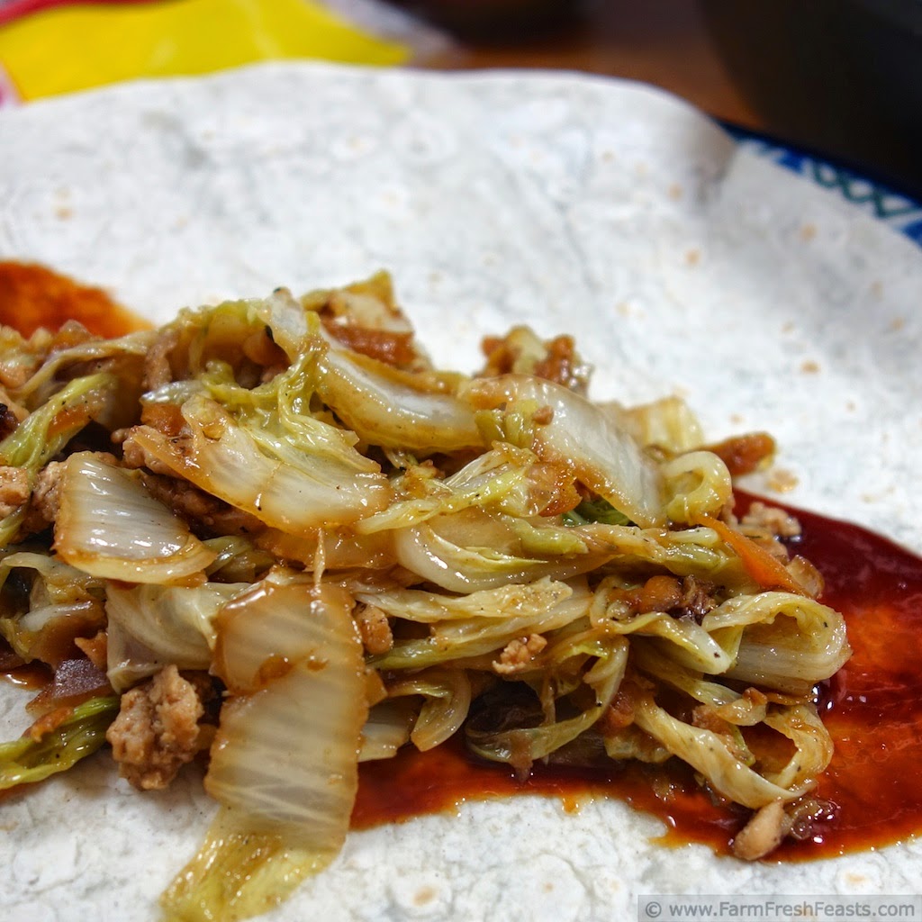 Ground chicken, Chinese cabbage, and mushrooms with hoisin sauce, rolled up Mu Shu style. This recipe can be served to vegetarians and omnivores alike because the meat is cooked separately from the vegetable filling.