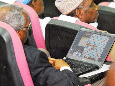 delegate playing scrabble laptop