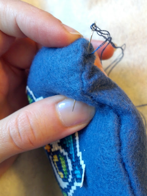 Bring the end of the thread through the fabric about 1" from the end of the seam