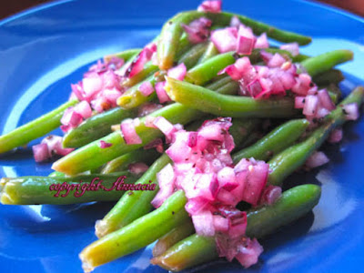 Salatah El Loobyea (Lebanese Green Bean Salad) Recipe This is a nice change of pace from the typical bland way of serving green beans Salatah El Loobyea (Lebanese Green Bean Salad) Recipe