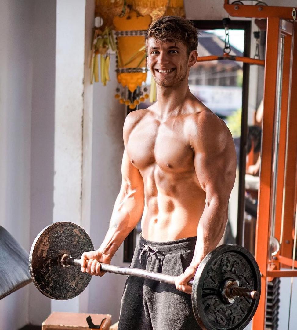 cute-young-shirtless-muscle-college-dude-smiling-lifting-weights-gym-huge-sweaty-biceps