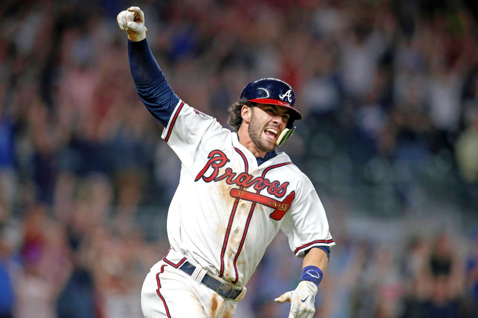 The Braves shortstop Dansby Swanson celebrates a walk-off single against th...