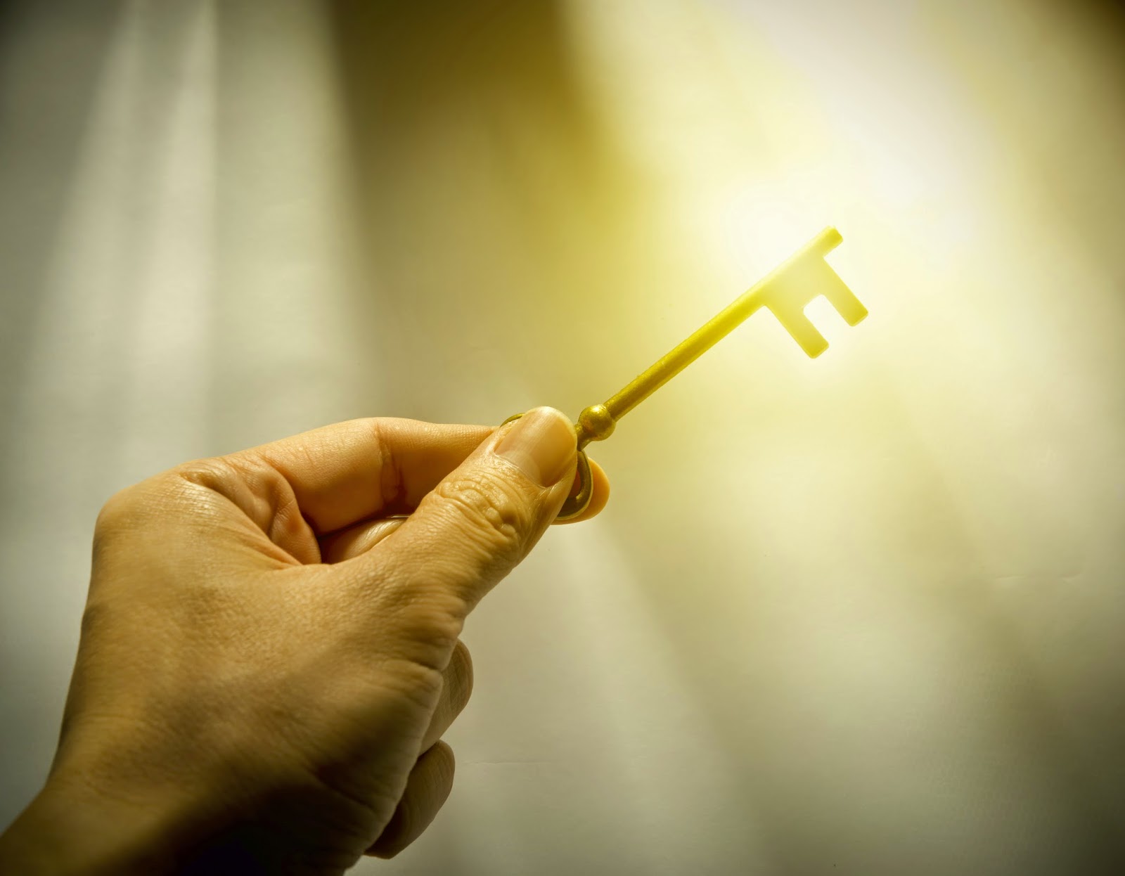 Key shining in gold light
