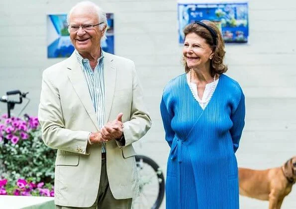 Queen Silvia wore a blue long cardigan from Issey Miyake. Pleats Please Issey Miyake long cardigan. Crown Princess Victoria and Princess Sofia