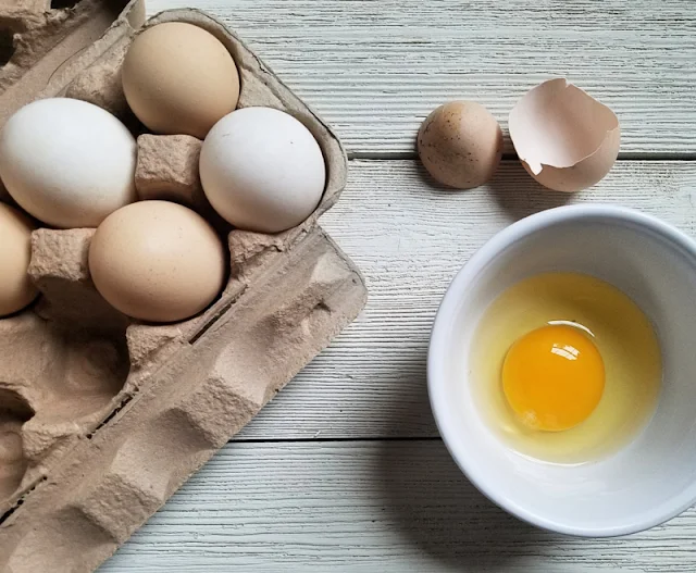 carton of brown and white eggs