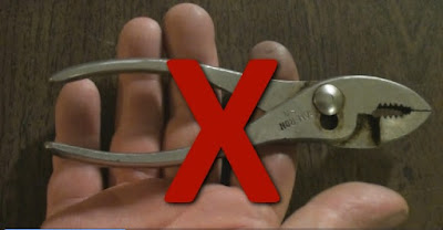 pliers with red X indicating not the tool to use for an oil change