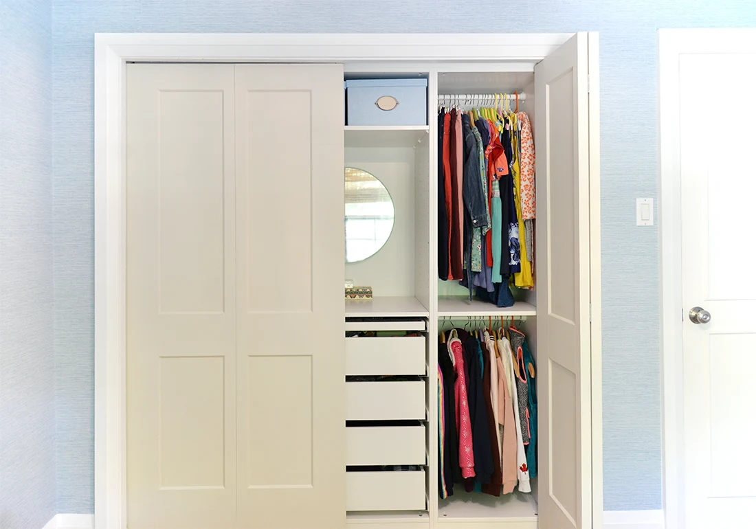 Keep your kid's clothes organized with the right closet system. We’ve used the IKEA PAX system to create our own built in DIY kids closet. Here's tips for kids closet organization, organization ideas for girls, and how to maximize storage in a small closet.