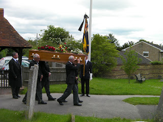 royal british legion flagbearer at funeral