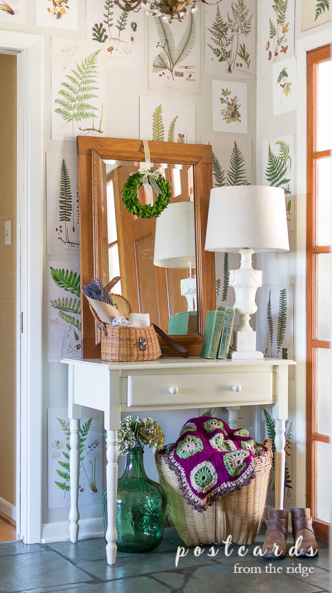 entry with free fern botanicals on wall