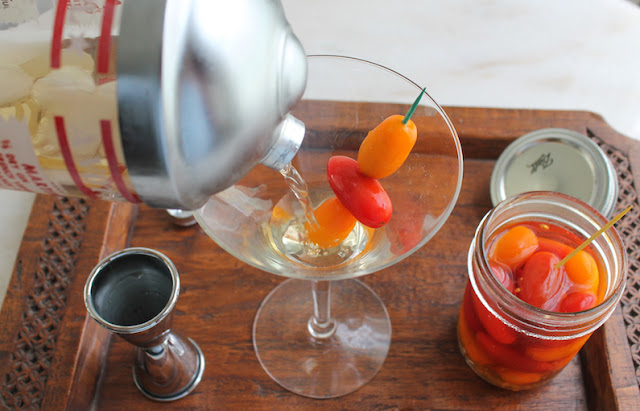 Food Lust People Love: A martini with a delicious difference, this spicy pickled tomato dirty martini is garnished with easy-to-make quick pickled grape tomatoes. The pickling liquid with rice vinegar and fish sauce also has a welcome hot kick from minced fresh chili pepper.