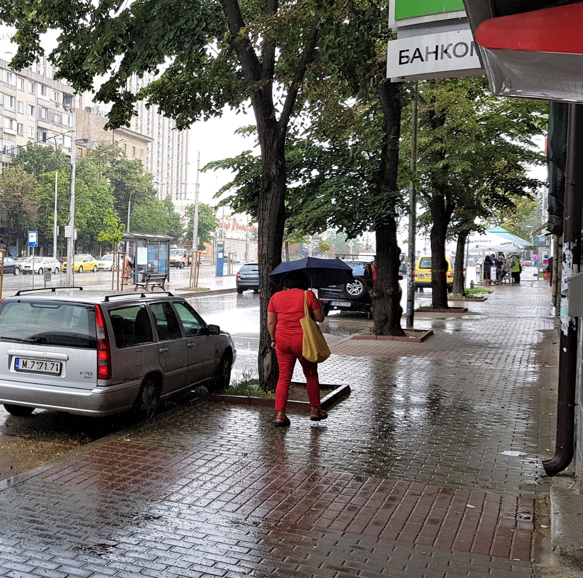 A woman walking holding an umbrella in Sofia