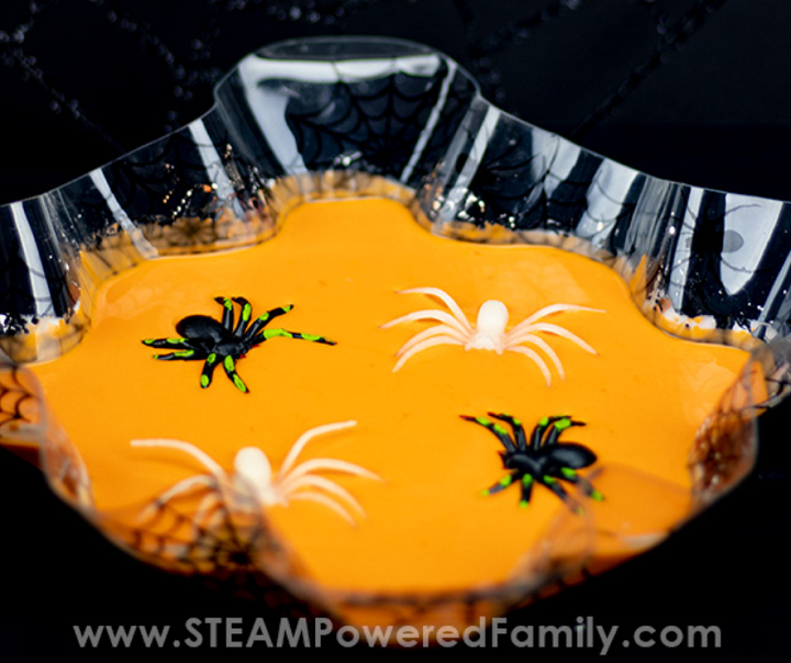 orange halloween oobleck with spiders