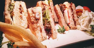 Veg Club Sandwich with Coleslaw and fries food recipe
