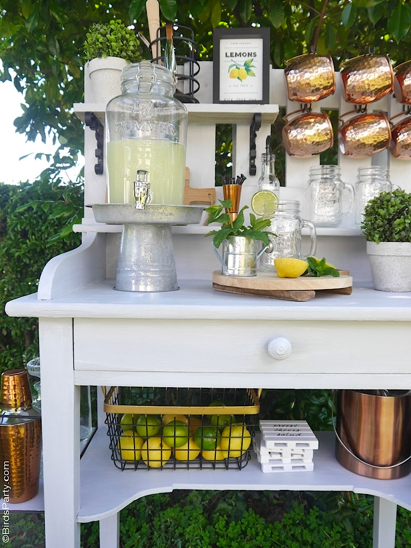 DIY Farmhouse Outdoor Bar or Potting Bench - using an old table and pallet, I created this functional and fun drinks bar in a farmhouse style! by BIrdsParty.com @birdsparty #diy #outdoorbar #diybar #drionksstation #farmhouse #farmhousedecor #farmhousediy #pottingbench #farmhousetable