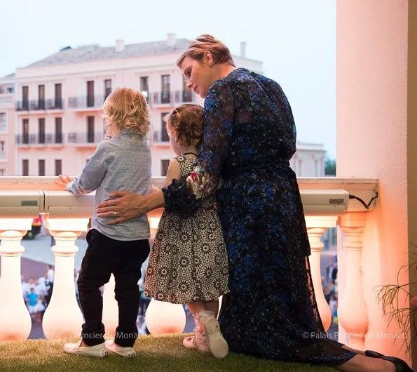 Princess Charlene, Princess Gabriella and Prince Jacques watched the traditional celebrations of St. John's Day procession at Palace Square in Monaco