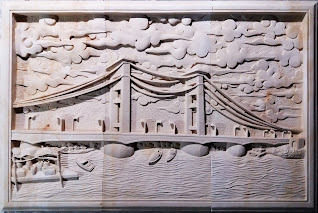 Relief batu alam paras putih motif jembatan ampera