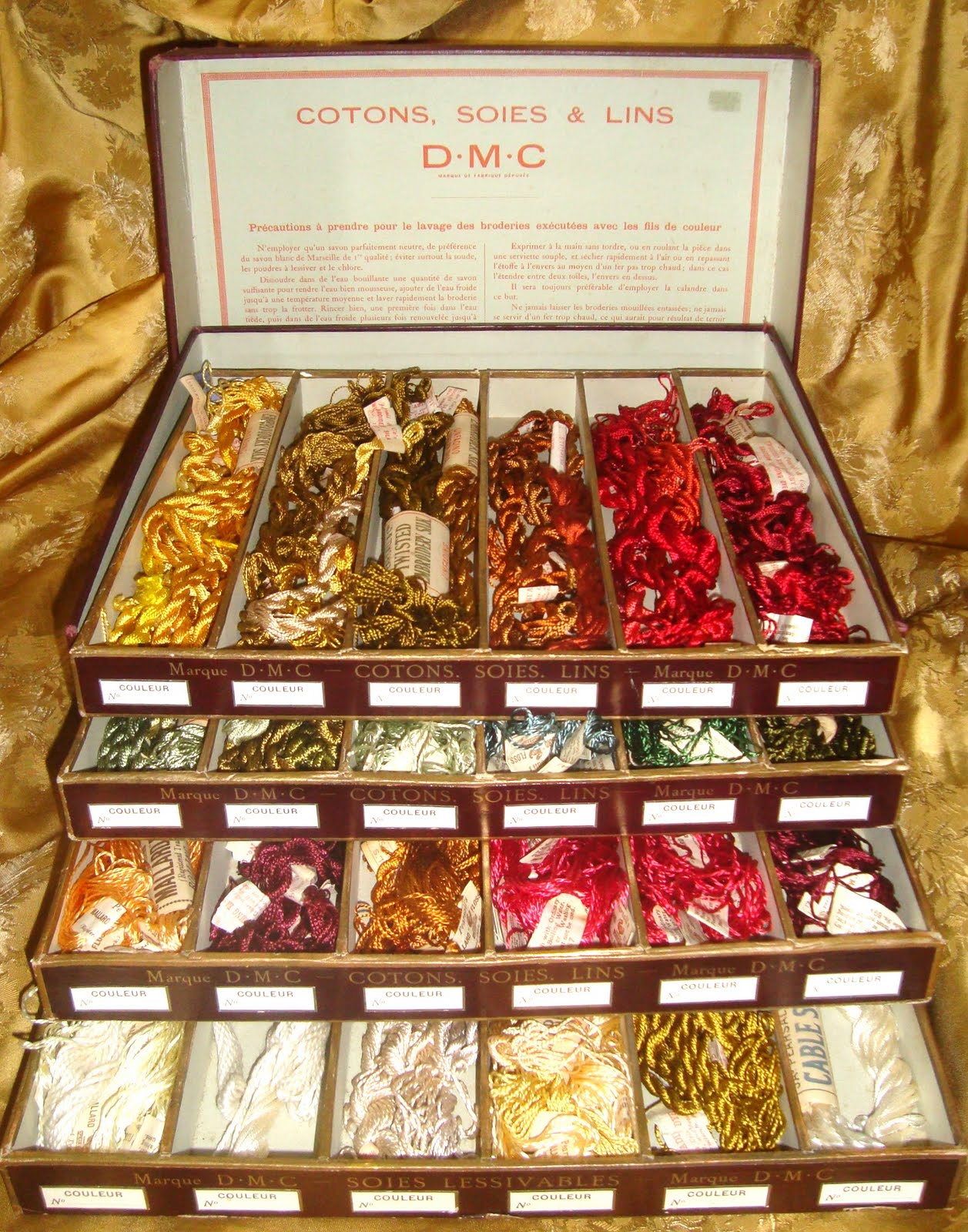 Interesting Antique Textiles A vintage shop display box of embroidery