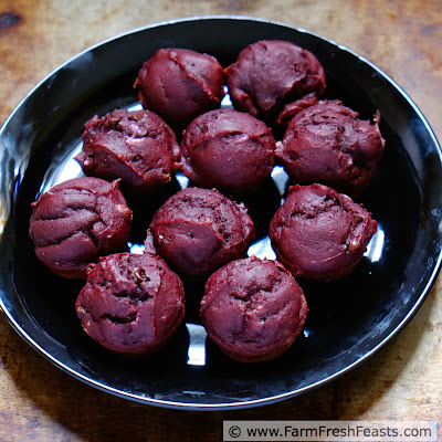 pic of a plate of cocoa beet chocolate chip muffins