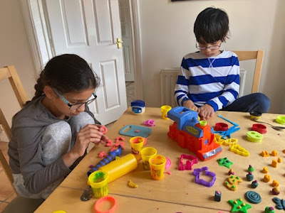 Older children playing with play dough