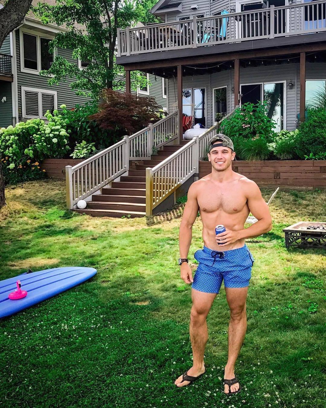 classic-shirtless-fit-bro-drinking-beer-lawn-yard-grass