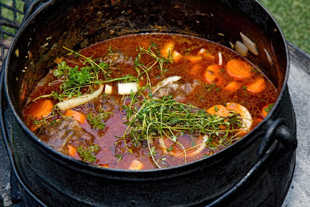 Potjiekos (Pot = potjie and Food =kos) is a traditional Southern African Afrikaner stew cooked in a cast iron pot over an open fire. 