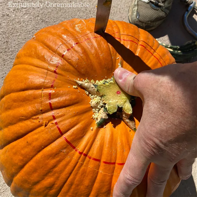 Cutting a pumpkin with a knife