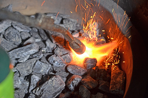 Lighting a kamado grill with a JJ George Grill Torch