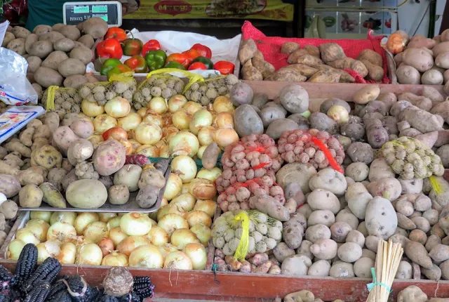 Potatoes and other root vegetables at San Isidro Mercado in Lima Peru.