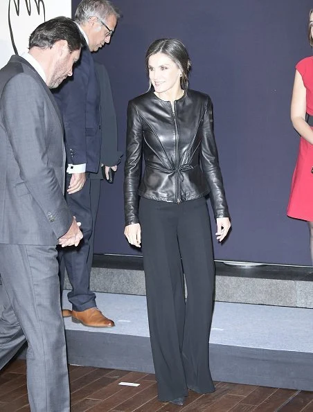 Queen Letizia wore a leather peplum jacket by EmporIio Armani and a black crepe wide-leg trousers by Carolina Herrera